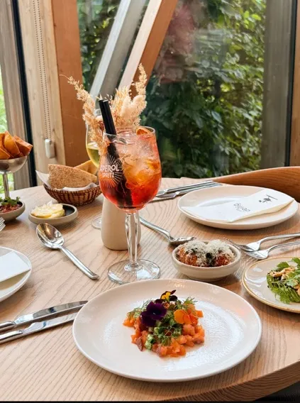 Aperol spritz and tartare on a set table