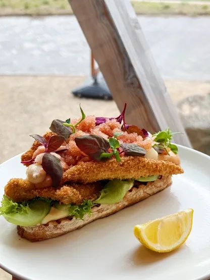Sandwich with breaded fish and prawns